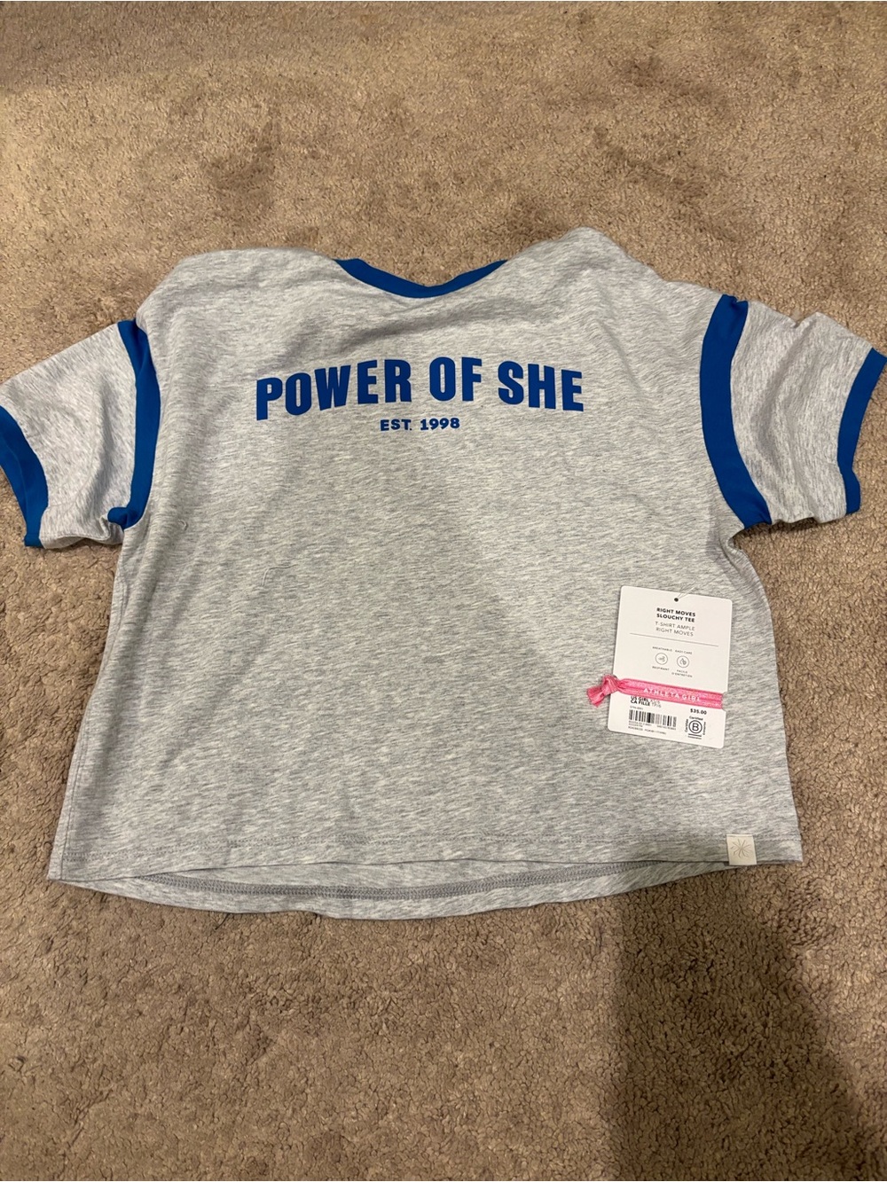 Athleta Grey Tee with Royal Blue Trim and 'Power of She' Print and hair tie